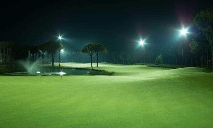 Golf course at night with the floodlights on.