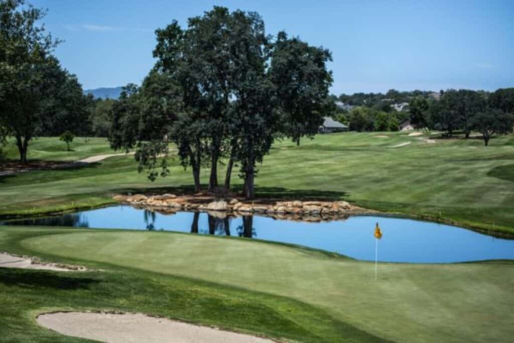 Golf course with pond.