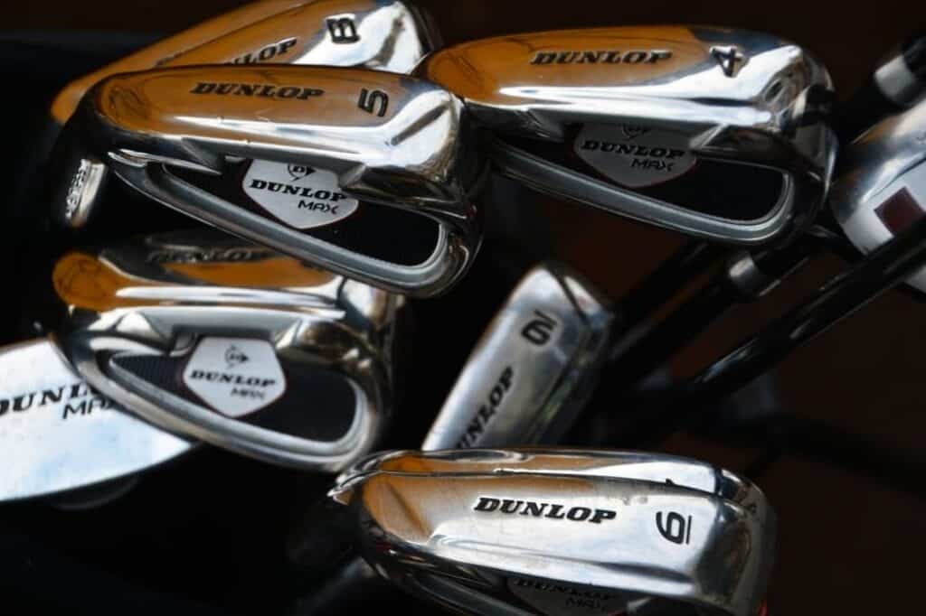 Several golf clubs.